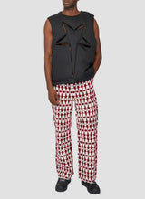 Houndstooth knit trousers with star pattern